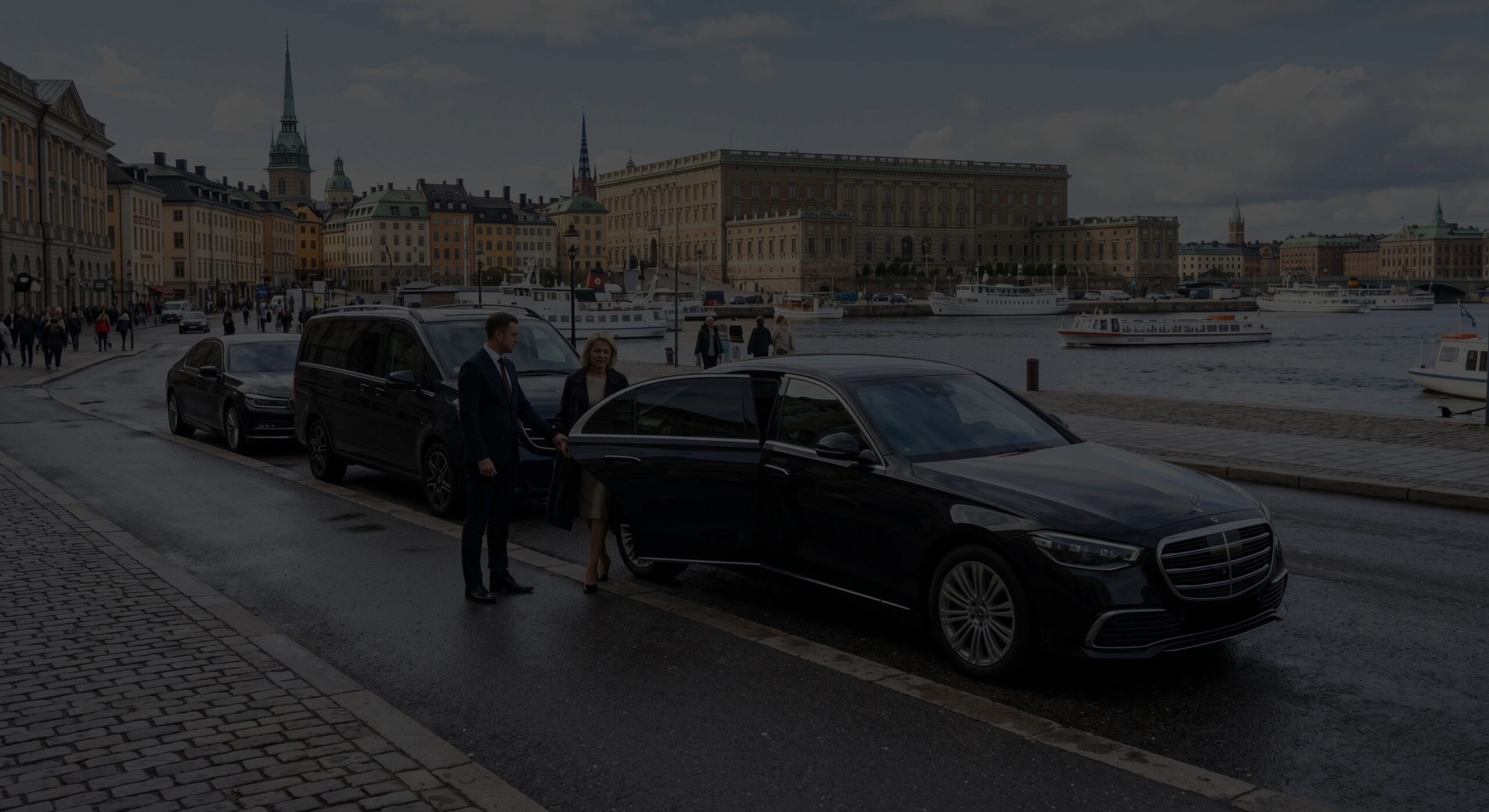 Chauffeur opening the door of a black Mercedes S-Class on the Stockholm waterfront